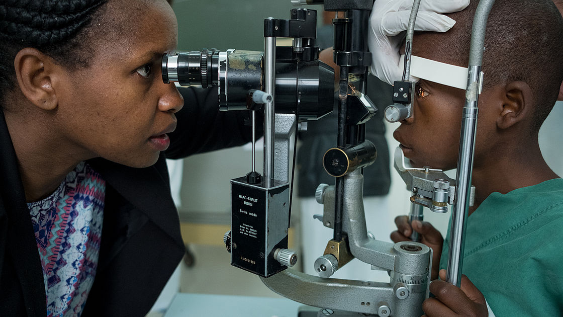 Dr. Mchikirwa Msina examining 11-year-old Omari's eyes.